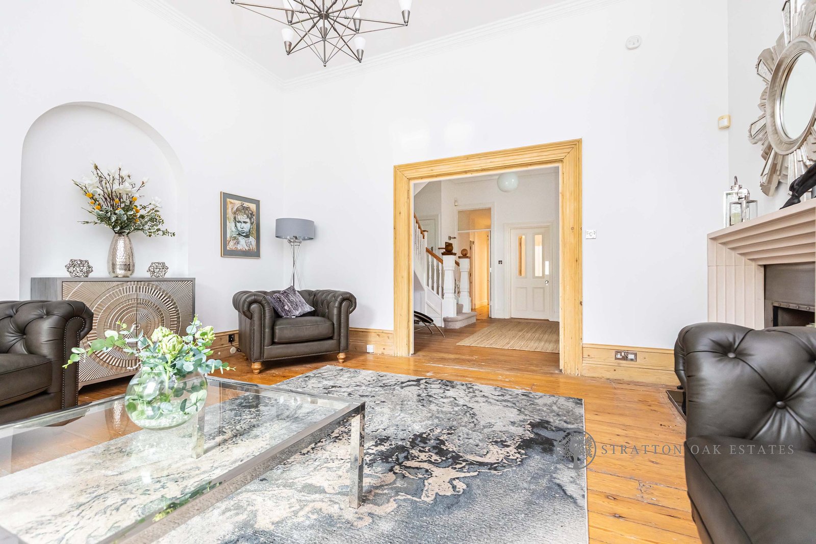 Formal lounge with Chesterfield sofas and fireplace